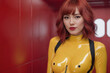 Strong real BDSM adult asian mistress wearing fetish latex rubber catsuit and poses in deep yellow erotic in red futuristic interior. Generative Ai
