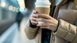 Urban Rhythm: Business Woman with Coffee in Subway Station