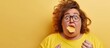 Young plus size woman holding potato chip stressed and frustrated with hand on head surprised and angry face. with copy space image. Place for adding text or design