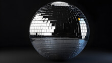 Glassy Silver Night Club Lighting Mirror Ball On A Black Background. Disco Ball On A Black Background