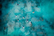 © AmazingAerialAgency - Aerial drone view of surfers catching waves at Trigg beach, Western Australia, Australia.