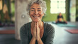 Smiling Mature woman meditating posing at a gym, pilates or yoga studio. Fitness, laughing and friends at the gym for training, pilates class and happy for exercise at a club. Smile, sport in a group 
