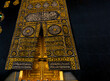 © Samet - The golden doors of the Holy Kaaba closeup, covered with Kiswah. Massive lock on the doors. Entrance to the Kaaba in Masjid al Haram