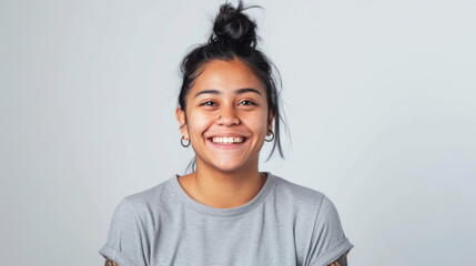 Sticker - A cheerful woman with red hair tied in a bun, laughing joyfully in a casual grey t-shirt, her freckles and bright expression conveying happiness.