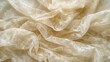 Close up of a crumpled beige floral patterned fabric