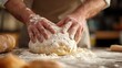 Cinematic close up of professional artisan baker chef is making with flour loaf of dough for preparation of pasta, pizza and other pastries in rustic bakery kitchen