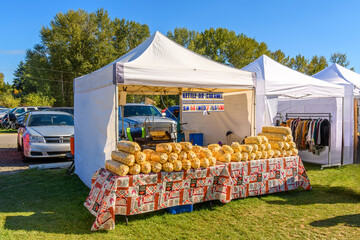 A popcorn, kettle corn, and caramel popcorn tent and kiosk at an Autumn harvest festival in the rural countryside near Spokane, Washington, USA.