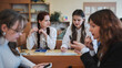 © Довидович Михаил - High school girls at a desk in the classroom between classes.