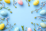 Fototapeta  - Easter spring background with Easter eggs and flowers on a bright blue background,
