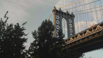 Wall Mural - Gimbal shot of the Manhattan Bridge at sunset from Brooklyn