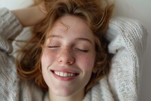 A Radiant Woman's Closed Eyes And Joyful Smile Showcase The Beauty Of Her Features, From Her Smooth Skin And Plump Lips To Her Expressive Eyebrows And Lashes, Against A Backdrop Of Warm Indoor Lighti