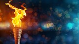 Fototapeta  - lit olympic torch with bokeh background