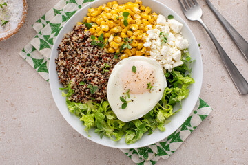 Wall Mural - Quinoa breakfast bowl with lettuce, fried egg and corn