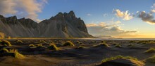 Dune landscape in front of mountain range in the morning light, Klifatindur with Vestrahorn, Hoefn, Austurland, Iceland, Europe