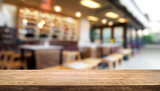 Fototapeta  - Selected focus empty brown wooden table and Coffee shop or restaurant blur background with bokeh image. for your photomontage or product display