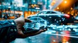 © Margo Alexa - Hand holding a holographic projection of a car with a cityscape background.futuristic city concepts or technology advertising.