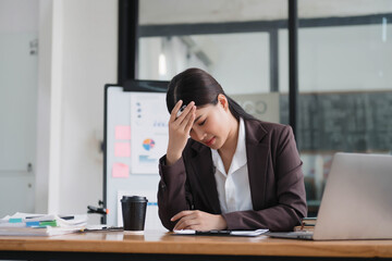 Poster - Stressed and overworked businesswoman having a headache with her workers, working overtime.