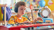 © myboys.me - An autistic boy wearing headphone, playing red piano keyboard in colorful music therapy classroom with joy and concentration in sunlight from window