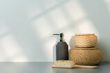 Fototapeta Mapy - Soap dispenser and hair brush on gray background