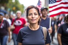 
Photograph A Middle-aged Hispanic Woman, Aged 39, Marching Alongside Others In A Demonstration Advocating For Immigrant Rights