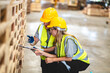 © chokniti - Female engineer using laptop computer for safety control checks or manufacturing maintenance work in factory building or construction site. woman engineer inspector working in industry product line