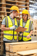© chokniti - Engineer team standing walking in warehouse examining hardwood material for wood furniture production, Worker check stock, Technician man and woman working on quality control in lumber pallet factory