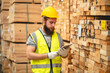 © chokniti - Engineer team standing walking in warehouse examining hardwood material for wood furniture production, Worker check stock, Technician man and woman working on quality control in lumber pallet factory