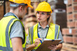 © chokniti - Engineer team standing walking in warehouse examining hardwood material for wood furniture production, Worker check stock, Technician man and woman working on quality control in lumber pallet factory