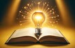 an open book with a brightly lit light bulb emerging from its pages