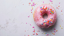 Freshly Baked Pink Glazed Donut With Sprinkles