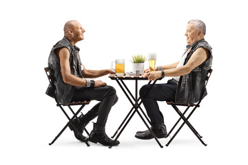 Wall Mural - Men in leather vests sitting at a table and having beer