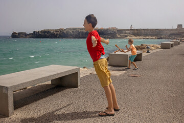 Wall Mural - Family, visiting the most south point of Europe, Tarifa in Spain	