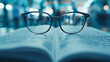 © Thanapipat - Close up of a medical research paper and glasses knowledge in medicine