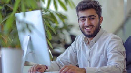 Aufkleber - Typical middle eastern businessman working at modern worktable, typing on computer keyboard, sending emails to business partners, doing marketing research, copy space available