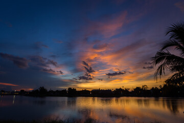 Wall Mural - Nature silhouette twilight sky on lagoon with light reflectio