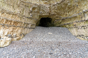 Wall Mural - Cave in a chalk cliff