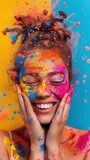 Fototapeta Sport - portrait happy smiling girl celebrating holi festival, colorful face, vibrant powder paint explosion, joyous festival