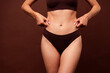 © deagreez - Cropped photo no retouch of lovely young lady clamp belly stomach folds wear trendy lingerie isolated on brown color background
