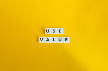 Wall Mural - Use Value Term and Banner. Text on Block Letter Tiles on Yellow Background. Minimalist Aesthetics.