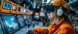© Hero Design - Adult woman miner worker using virtual reality headset for controlling mining machine. Generative AI technology.