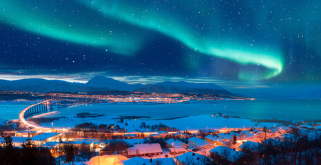 Wall Mural - aurora borealis or northern lights in the sky over tromso with sandnessundet bridge - tromso, norway