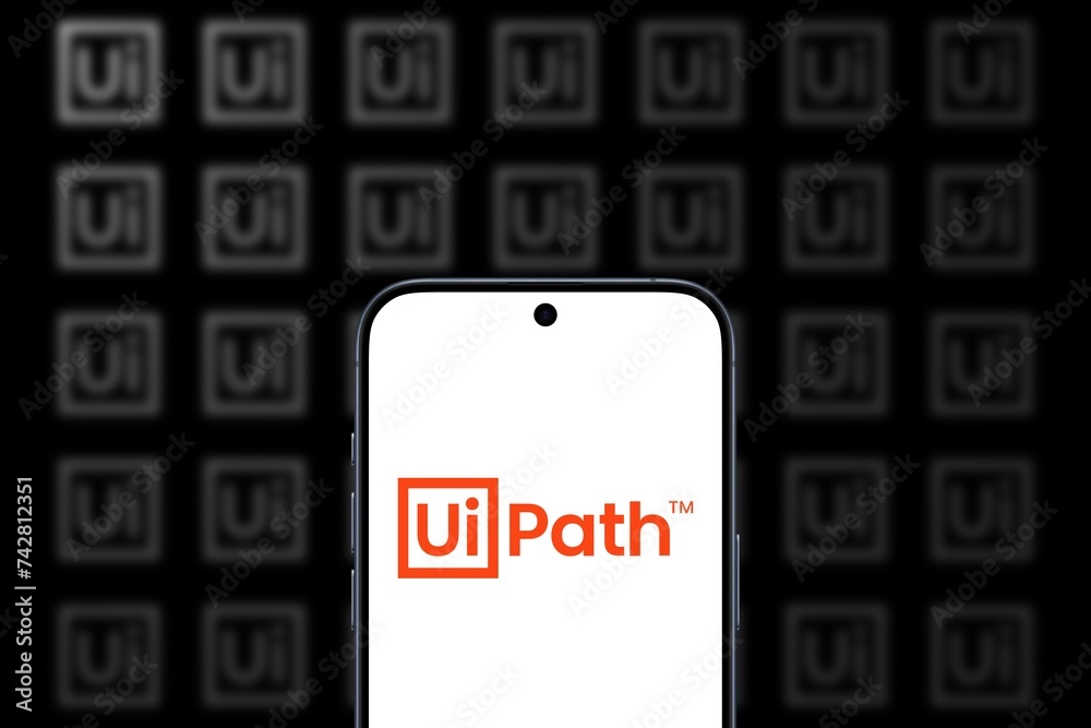 UiPath Logo is displayed on a modern smartphone, global software ...