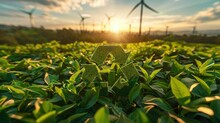 Green Recycling Symbol With Sunrise Over A Field With Wind Turbines. Green Energy Solutions And Sustainable Power Engineering And Eco-friendly Technology. Generative AI