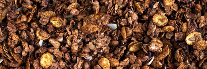 Wall Mural - Organic roasted granola cereal banner. Top view muesli background texture panoramic web header. Wide screen wallpaper