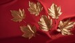 Decorative golden leaves on red textile backdrop. Bright, glamour autumnal concept with fake fall leaves on red silk backdrop