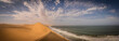 © Travel 'n' Lifestyle - View of sand dunes from the Namib desert along the coastline facing the Atlantic Ocean, Namibia.