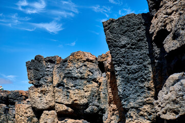 Wall Mural - Natural swimming pool in Caleta de Fuste, Fuerteventura, Spain, Atlantic Ocean and huge volcanic rocks