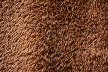 Wall Mural - Texture of a brown faux fur as a background.