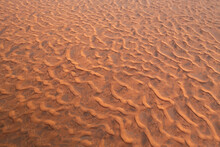 Aerial View Of Endless Desert Landscape With Warm Orange Sand Dunes, Sharjah, United Arab Emirates.