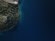 © AmazingAerialAgency - Aerial view of Azure Adriatic Coastline with Pine Forests on Brac Island, Croatia.